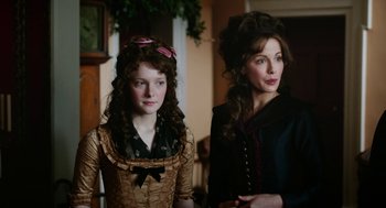 Movie still from “Love & Friendship” (2016), directed by Whit Stillman – A woman and a young girl standing next to each other; Close Up shot, Over the shoulder angle