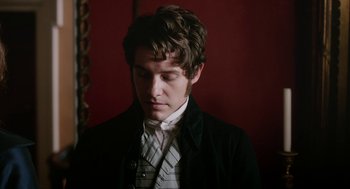 Movie still from “Love & Friendship” (2016), directed by Whit Stillman – A young man wearing a suit and a tie; Close Up shot, Over the shoulder angle