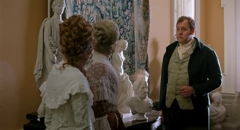 Movie still from “Love & Friendship” (2016), directed by Whit Stillman – A group of people standing next to each other in a room; Medium shot, Over the shoulder angle