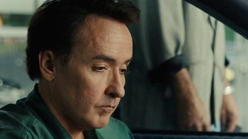 Movie still from “Love & Mercy” (2014), directed by Bill Pohlad – A person sitting in a chair; Close Up shot, Low angle