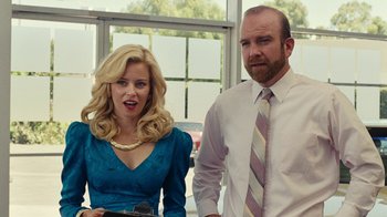 Movie still from “Love & Mercy” (2014), directed by Bill Pohlad – A man and a woman standing next to each other in front of a window; Medium shot, Over the shoulder angle