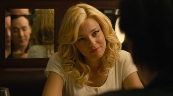 Movie still from “Love & Mercy” (2014), directed by Bill Pohlad – A woman sitting at a table looking at the camera; Close Up shot, Over the shoulder angle