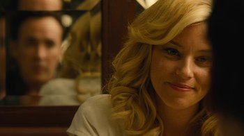 Movie still from “Love & Mercy” (2014), directed by Bill Pohlad – A woman with long blonde hair sitting at a table; Close Up shot, Over the shoulder angle