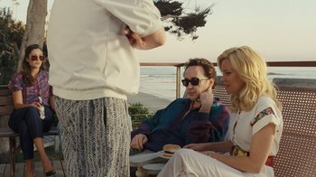 Movie still from “Love & Mercy” (2014), directed by Bill Pohlad – A man and a woman sitting at a table with food; Medium shot, Over the shoulder angle
