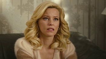 Movie still from “Love & Mercy” (2014), directed by Bill Pohlad – A woman with blonde hair sitting in front of a window; Close Up shot, Over the shoulder angle