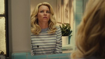 Movie still from “Love & Mercy” (2014), directed by Bill Pohlad – A woman looking in the mirror in front of a bathroom mirror; Medium shot, Over the shoulder angle