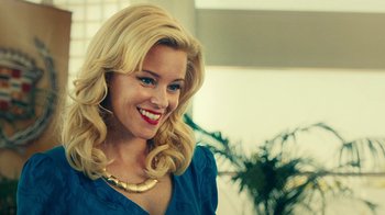 Movie still from “Love & Mercy” (2014), directed by Bill Pohlad – A woman with blonde hair wearing a blue dress; Close Up shot, Over the shoulder angle