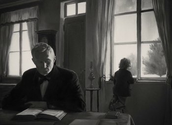 An older man sitting at a table reading a book