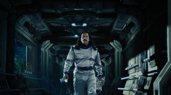 Movie still from “Machete Kills” (2013), directed by Robert Rodriguez – A man in a spacesuit walking in an underground space; Medium shot, Low angle
