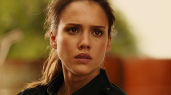 Movie still from “Machete Kills” (2013), directed by Robert Rodriguez – A person wearing a black shirt; Close Up shot, Over the shoulder angle