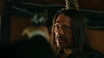 Movie still from “Machete Kills” (2013), directed by Robert Rodriguez – A person with a rope around his neck; Close Up shot, Low angle