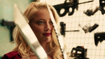 Movie still from “Machete Kills” (2013), directed by Robert Rodriguez – A woman with blonde hair and red lipstick looking into a mirror; Close Up shot, Over the shoulder angle