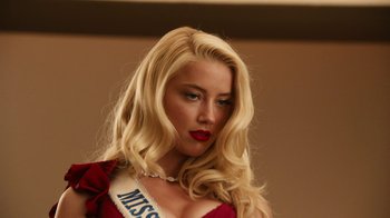 Movie still from “Machete Kills” (2013), directed by Robert Rodriguez – A beautiful blonde woman in a red dress; Close Up shot, Low angle