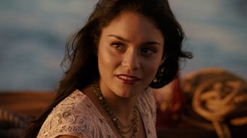 Movie still from “Machete Kills” (2013), directed by Robert Rodriguez – A person wearing a necklace; Close Up shot, Over the shoulder angle