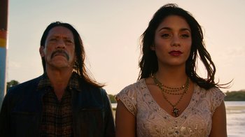 Movie still from “Machete Kills” (2013), directed by Robert Rodriguez – A man and a woman standing next to each other; Close Up shot, Low angle