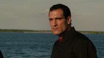 Movie still from “Machete Kills” (2013), directed by Robert Rodriguez – A person near a body of water; Close Up shot, Low angle