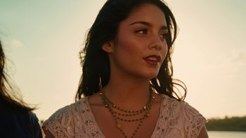 Movie still from “Machete Kills” (2013), directed by Robert Rodriguez – A woman with long black hair wearing a necklace; Close Up shot, Low angle