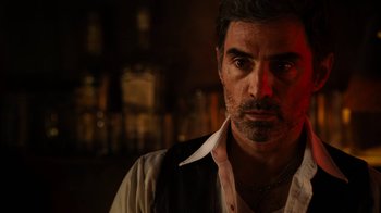 Movie still from “Machete Kills” (2013), directed by Robert Rodriguez – A person wearing a vest; Close Up shot, Low angle