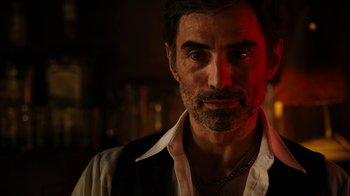 Movie still from “Machete Kills” (2013), directed by Robert Rodriguez – A person with a beard; Close Up shot, Over the shoulder angle