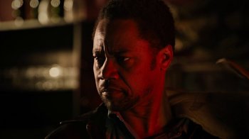 Movie still from “Machete Kills” (2013), directed by Robert Rodriguez – A person wearing a jacket; Close Up shot, Low angle