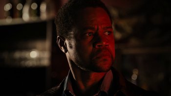 Movie still from “Machete Kills” (2013), directed by Robert Rodriguez – A person wearing a jacket; Close Up shot, Low angle