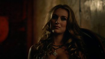 Movie still from “Machete Kills” (2013), directed by Robert Rodriguez – A beautiful woman with long brown hair wearing a necklace; Close Up shot, Over the shoulder angle