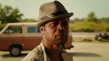 Movie still from “Machete Kills” (2013), directed by Robert Rodriguez – A person wearing a hat; Close Up shot, Low angle