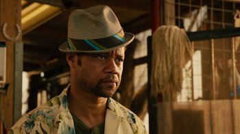 Movie still from “Machete Kills” (2013), directed by Robert Rodriguez – A person wearing a hat; Close Up shot, Low angle