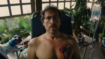 Movie still from “Machete Kills” (2013), directed by Robert Rodriguez – A man with a heart cut out of his chest; Close Up shot, High angle