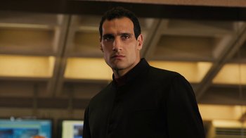 Movie still from “Machete Kills” (2013), directed by Robert Rodriguez – A person wearing a black shirt; Close Up shot, Low angle