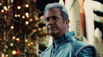 Movie still from “Machete Kills” (2013), directed by Robert Rodriguez – An older man in a blue jacket is looking at the camera; Close Up shot, Low angle