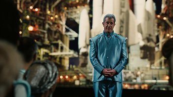 Movie still from “Machete Kills” (2013), directed by Robert Rodriguez – A man standing in front of a space ship; Wide shot, Over the shoulder angle