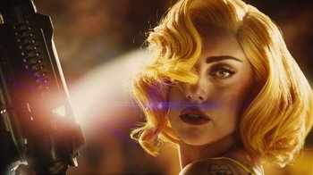 Movie still from “Machete Kills” (2013), directed by Robert Rodriguez – A person holding a hair dryer; Close Up shot, Low angle