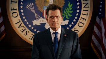 Movie still from “Machete Kills” (2013), directed by Robert Rodriguez – A man in a suit and tie in front of a seal; Close Up shot, Low angle