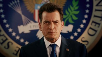 Movie still from “Machete Kills” (2013), directed by Robert Rodriguez – A person wearing a suit and tie; Close Up shot, Low angle