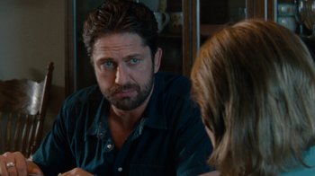 Movie still from “Machine Gun Preacher” (2011), directed by Marc Forster – A person looking at a person in a mirror; Close Up shot, Over the shoulder angle