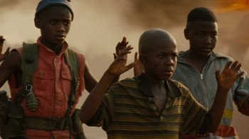 Movie still from “Machine Gun Preacher” (2011), directed by Marc Forster – A group of young men standing next to each other on top of a hill; Close Up shot, Low angle
