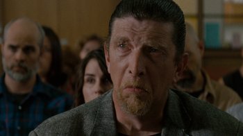 Movie still from “Machine Gun Preacher” (2011), directed by Marc Forster – A person wearing a jacket; Close Up shot, Over the shoulder angle