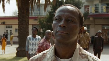 Movie still from “Machine Gun Preacher” (2011), directed by Marc Forster – A person looking up at the sky; Close Up shot, Low angle