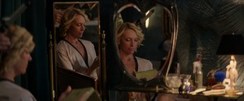 Movie still from “Madame” (2017), directed by Amanda Sthers – A woman looking at her reflection in a mirror; Medium shot, Over the shoulder angle