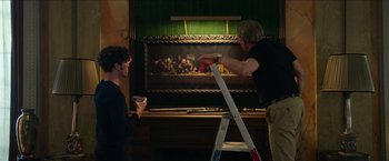 Movie still from “Madame” (2017), directed by Amanda Sthers – Two men are painting a painting on a ladder; Wide shot, Low angle