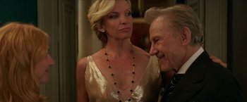 Movie still from “Madame” (2017), directed by Amanda Sthers – An older man and a younger woman in a room; Close Up shot, Over the shoulder angle