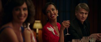 Movie still from “Madame” (2017), directed by Amanda Sthers – A woman holding a wine glass and smiling for the camera; Close Up shot, Over the shoulder angle