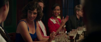 Movie still from “Madame” (2017), directed by Amanda Sthers – A group of people sitting at a dinner table clapping; Close Up shot, Over the shoulder angle