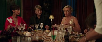 Movie still from “Madame” (2017), directed by Amanda Sthers – A man and a woman sitting at a dinner table; Medium shot, Over the shoulder angle