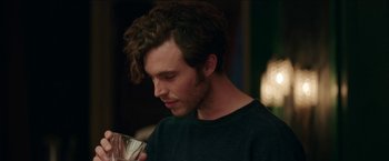 Movie still from “Madame” (2017), directed by Amanda Sthers – A person holding a cup; Close Up shot, Over the shoulder angle