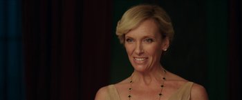 Movie still from “Madame” (2017), directed by Amanda Sthers – A person wearing a necklace; Close Up shot, Over the shoulder angle