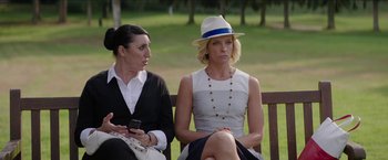 Movie still from “Madame” (2017), directed by Amanda Sthers – Two women sitting on a park bench looking at each other; Medium shot, Over the shoulder angle