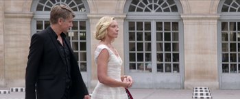 Movie still from “Madame” (2017), directed by Amanda Sthers – A man and a woman walking down a street; Medium shot, Over the shoulder angle