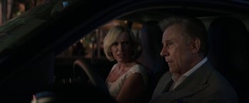 Movie still from “Madame” (2017), directed by Amanda Sthers – An older man and a younger woman in a car at night; Close Up shot, Over the shoulder angle